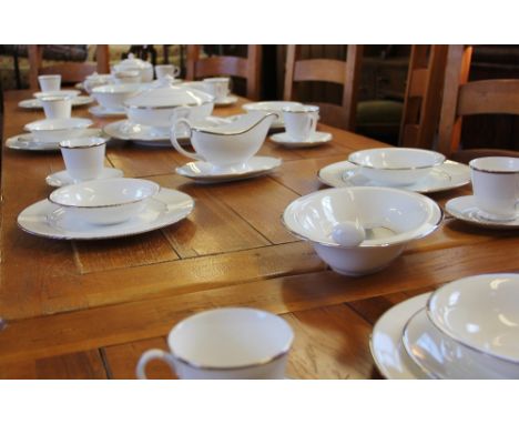 A Royal Worcester Monaco pattern dinner service, comprising; a teapot and cover, eight cups and saucers, eight bowls, eight d