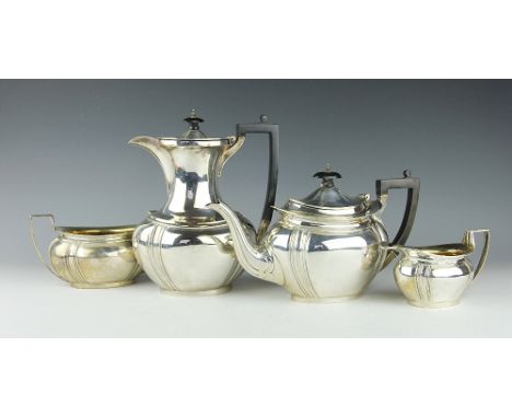 A silver four piece tea and coffee service, James Deakin and Sons, Sheffield 1906, each piece of low oval form, comprising; t