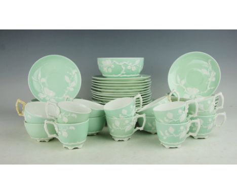 A Victorian tea and coffee service E J D Bodley, June 1876, pattern No.2527, relief moulded with flowering roses against a ce