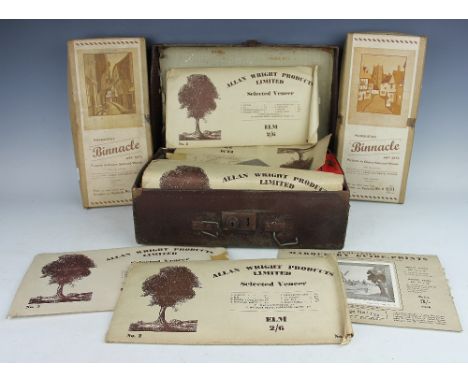 A leather bound case containing assorted marquetry 'Binnacle' art sets and home craft marquetry guide print within original b