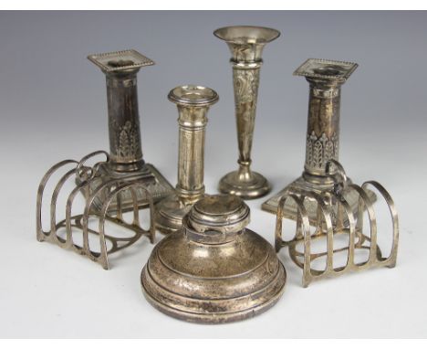 A pair of silver candlesticks, Elkington & Co, Sheffield 1937, moulded as acanthus wrapped columns with beaded rims, 13.5cm h