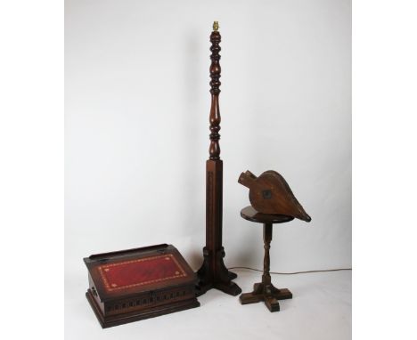 A oak cased writing slope, the canted leather embossed top enclosing a compartmented interior, 25cm H x 54cm W x 40cm D, alon