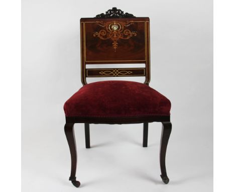 A Victorian inlaid bedroom chair, the mahogany chair with mother of pearl and abalone shell detail to the back with florally 