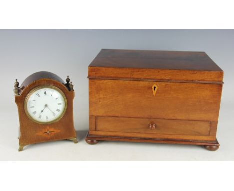 A Victorian flame mahogany work box, the rectangular box with compartmented interior and single drawer, raised on four bun fe