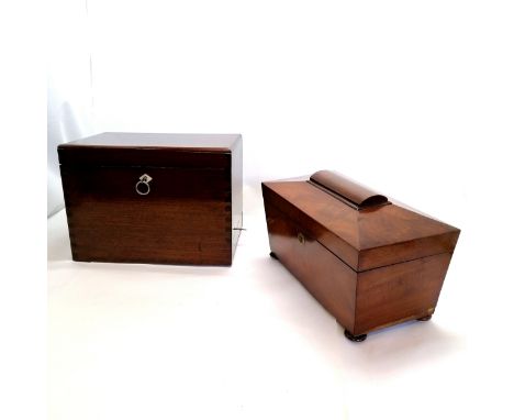 Mahogany tea caddy with bun feet and brass escutcheons missing mixing bowl and inner lids and lose of veneer to one side t/w 
