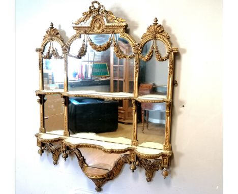 Regency giltwood wall mirror with swag decoration and shelf detail. Bottom shelf detail has become detached, but present. 90c