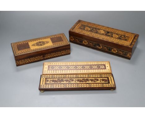 A Tunbridge Ware games box, with cribbage top, two cribbage boards and a playing card boxCONDITION: Largest box - escutcheon 