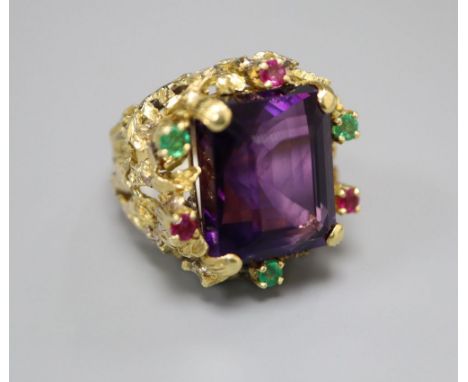 A yellow metal, amethyst, emerald and ruby cluster set naturalistic dress ring, size M, gross 20.9 grams.CONDITION: Two of th