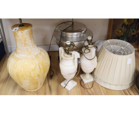 A pair of alabaster lamps, a silver coloured lamp etc