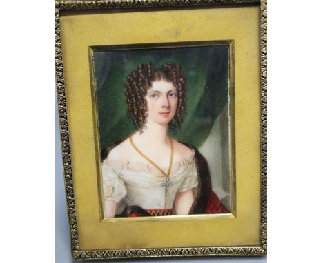 An early 19th century portrait miniature on ivory of a lady, half length, 8 x 6cm, later framed