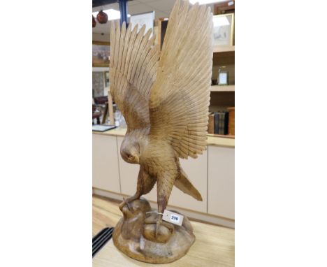 A contemporary carved wood model of a Golden Eagle