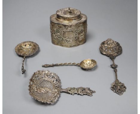 A Dutch oval silver tea caddy, embossed with cherubs and scrolls, 1893 import marks and four sifter spoons, various (one hall