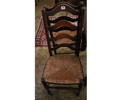 A pair of 19th century ladder-back oak chairs with rush seats