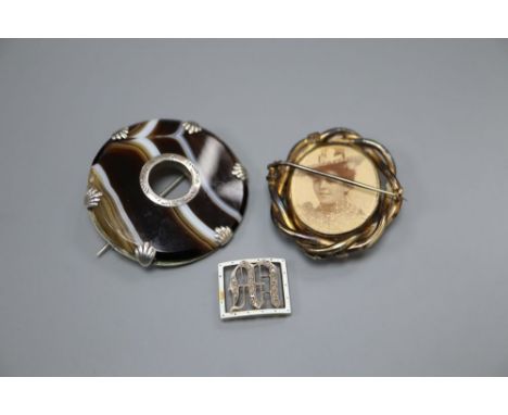 An Edwardian yellow metal, diamond and enamel set initial bracelet buckle, 17mm and two brooches, including Victorian mournin