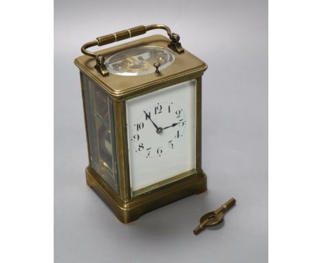 A French brass repeating carriage clock, enamelled dial, Obis case, height 18cm incl. handle
