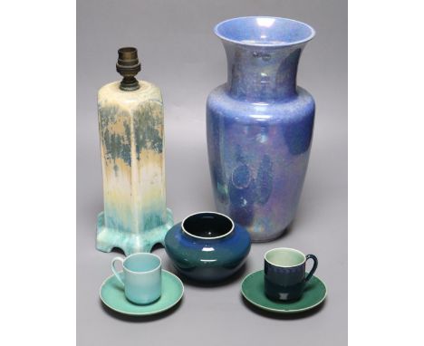 A collection of Ruskin pottery, including a blue lustre vase, a table lamp banded in green, cream and turquoise, a small blue