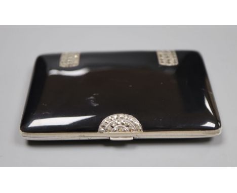 A late 1920's silver, black enamel and marcasite set cigarette case, import marks for George Stockwell, London, 1929, 82mm, g