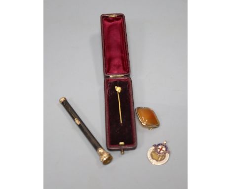 An early 20th century gold plate mounted propelling pencil, an agate set brooch, a 9ct gold and enamel medallion and a fox he