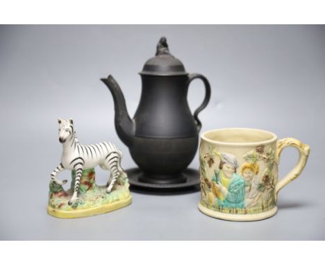 A 19th century Staffordshire pottery model of a zebra, a Victorian relief-moulded frog mug, a black basalt coffee pot with co