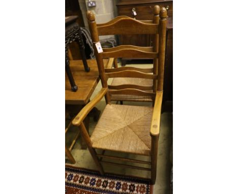 A set of eight ladder back rush seat dining chairs