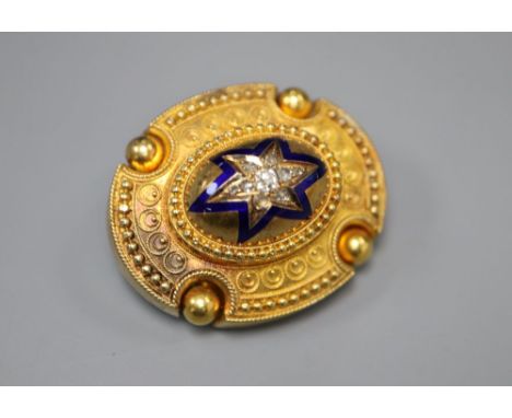 A Victorian yellow metal, blue enamel and diamond set oval mourning brooch, verso with hair below glazed panel and engraved i