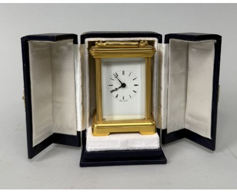 A BRASS CARRIAGE CLOCK PRESENTED AS A DIPLOMATIC GIFT BY QUEEN ELIZABETH IIHoused in a blue leather case with gilt detail and