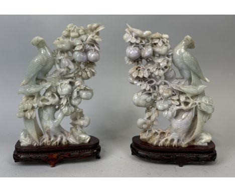 A PAIR OF CHINESE JADE SCULPTURES DEPICTING BIRDS ON BRANCHES WITH FRUITApproximately 29cm x 21cm each.Each mounted on stands