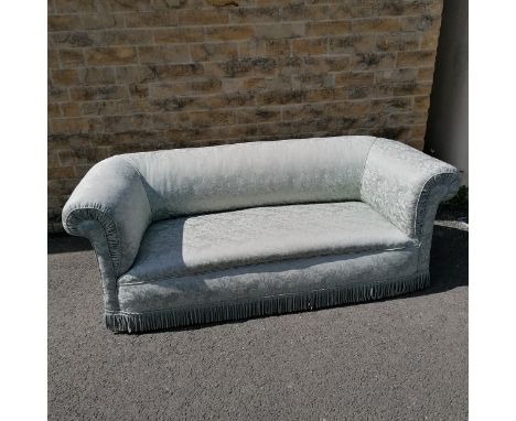 Antique blue upholstered chesterfield sofa with mahogany feet with castors. Has some staining to the fabric otherwise in good