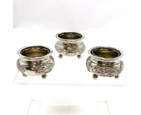 3 x Chinese silver (900 quality) salts (pair + 1 matched) decorated with a dragon &amp; with clear glass liners marked WC, Wi