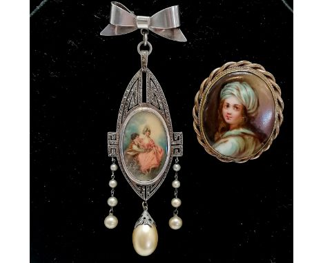 Unusual sterling silver marked brooch with hand painted portrait miniature set with marcasite &amp; has a bow shaped suspende