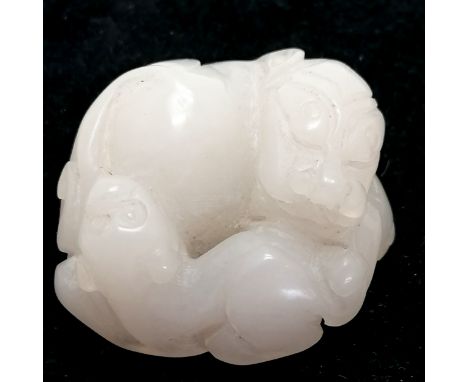 Chinese Qing mutton fat jade carving of a dog with a puppy - 3.5cm across 