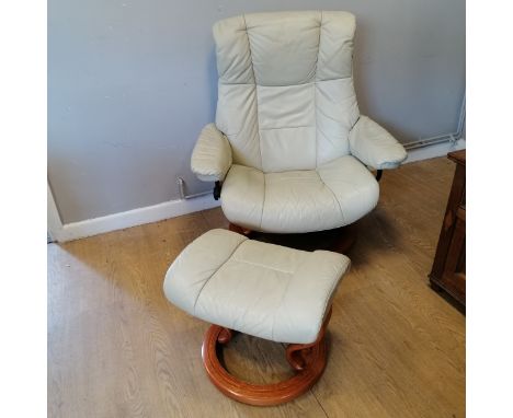 Vintage cream leather 'stressless' swivel chair and footstool in good used condition. width 88cm x height 102cm x 65cm deep 
