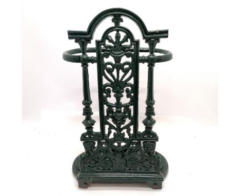Cast iron green enamel painted stick stand and is designed to lean against the wall - 52cm high x 31cm wide 