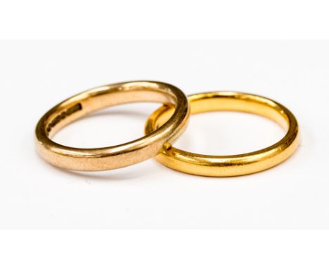 Two 9ct yellow and rose gold wedding bands, weighing approximately 7.0 grams, approximately 2mm and 3mm, ring sizes K 1/2 and