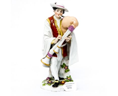 A Meissen figure of a pipe player, marked to base (af) (chips to hat, feathers, fingers, shoes and leaves, head has been off)