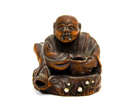 Japanese carved wood netsuke, signed to base.