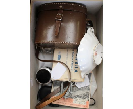 A cine camera, Brass Admura 811A together with a film reel of the 1953 Coronation and a case pair of binoculars 