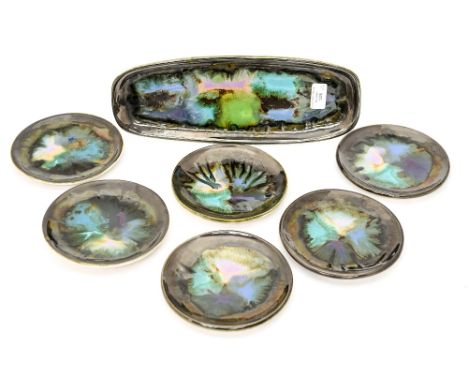 Eric Leaper, a Newlyn Pottery sandwich set including six small plates and long plate, patch work abstract glaze (7)