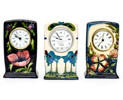Two Moorcroft mantle clocks (silver line to base) with one Moorcroft G.R. mantle clock (3) 