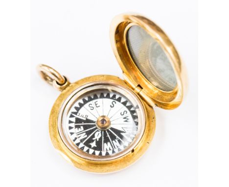 An unstamped 18ct yellow gold round compass/locket, approx diameter of 2.5cm with a gross total weight of 12.1 grams. 