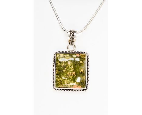 A Unakite pendant necklace, the pendant with a square cabouchon set on a silver mount, fitted on a silver snake link chain, 4