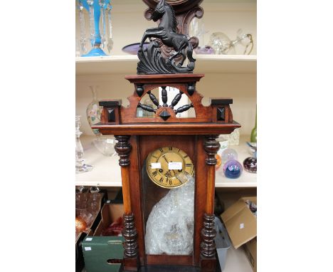 A late 19th Century style Vienna wall clock, with plaque reading 'H Samuel', having an eight day movement, the top surmounted