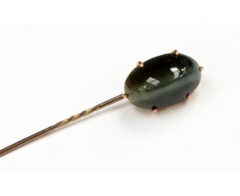 A Victorian cat's eye chrysoberyl and 9ct yellow gold stick pin, the claw set oval chrysoberyl cabochon approximately 15.81 x