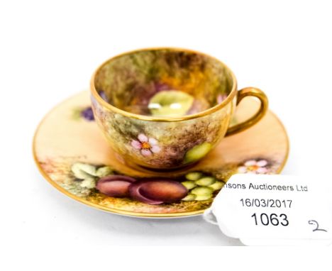 A miniature cup and saucer Royal Worcester signed 'Roberts ' 
