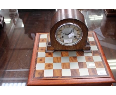 A Selangor pewter table top cased chess set, with an Enfield mantle clock. pendulum and key (2)