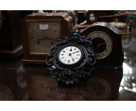 An Elliott 1930s mantel clock, a Smiths Enfield bakelite clock, an an black cast metal clock, possibly 19th Century (3)