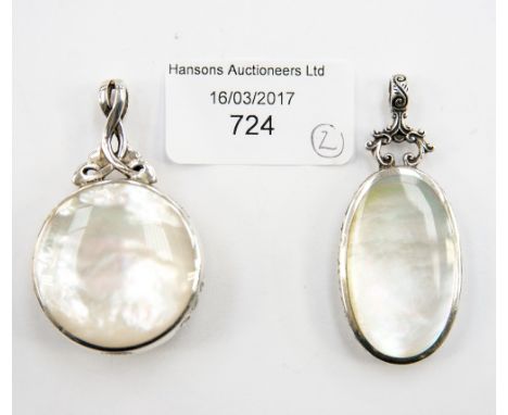 A sterling silver double sided pendant with Celtic knot surmount, set mother of pearl and to the reverse, polished hardstone 