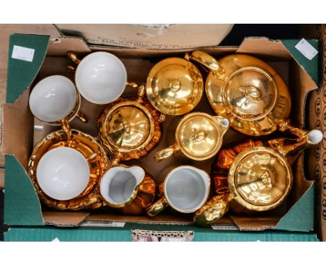 A Royal Worcester gilt four piece tea service, comprising teapot, milk jug, sugar bowl and hot water jug, together with a Bav