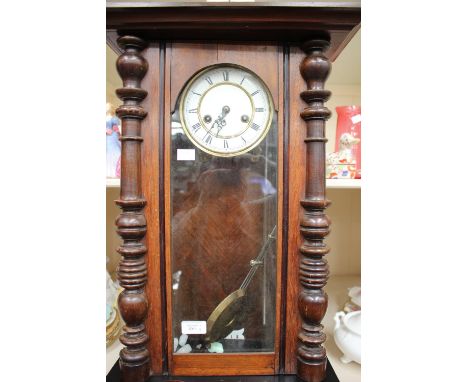 A mahogany drop dial wall clock, and an American Ansonia clock(2)
