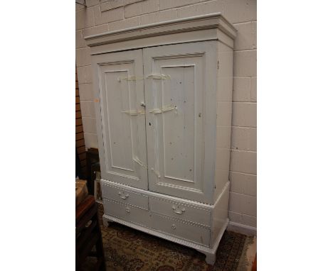 A George III white painted linen press, the doors opening to reveal four tiers of runners and a later hanging rail, the base 
